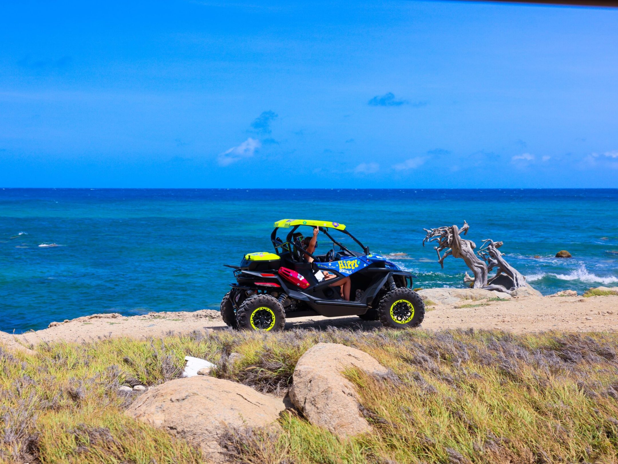 a motorcycle that is sitting on a rocky beach